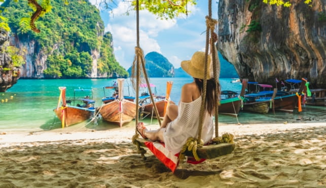 Woman sitting in a hammock in thailand